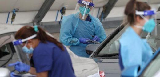 Australia COVID-19 infections hit record amid runaway Omicron outbreak