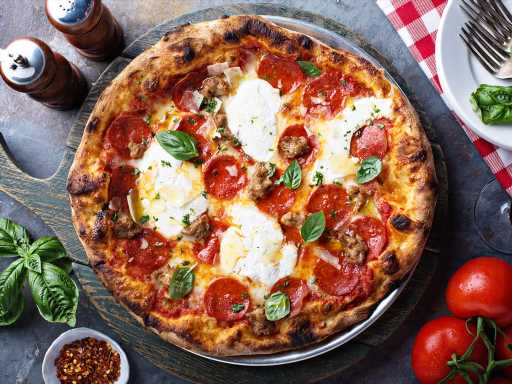 Everything You Need to Make Pizza At Home For the Super Bowl So You Can Skip the Pricey Delivery