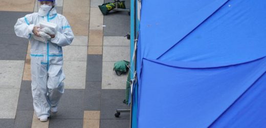 Hong Kong "overwhelmed" as COVID infections hit record