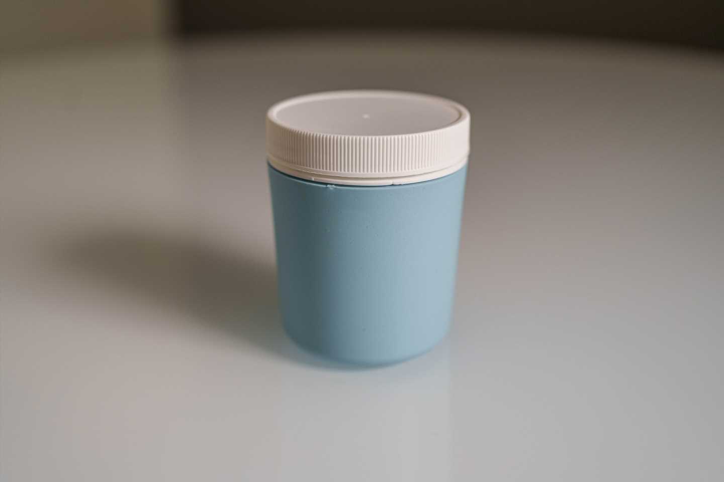 A specimen collection cup that creates a more favorable environment for sperm